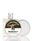 Beard balm packaging with a label featuring a person and product name on a white background