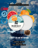 TM PH Beard Balm container with citrus fruits on a blue water background