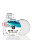 Beard balm packaging with a beach scene label on a white background