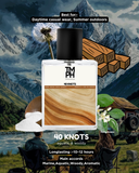Perfume bottle labeled '40 Knots' with mountain and nature-themed background