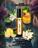Perfume bottle labeled 'Street Club' with a scenic background of flowers and a drink.