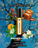 Roll-on bottle labeled 'Romance & Love' with floral and fruit elements on a decorative background.
