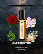 Perfume bottle labeled 'Love Doesn't Shy' with decorative elements on a dark background