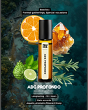 ADG Profondo perfume bottle with citrus fruits and crystals on a dark background