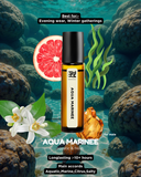 Aqua Marinee perfume bottle with underwater scene, flowers, and a grapefruit slice.