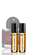 Two bottles of Mandarin Tobacco perfume by Byredo on a white background