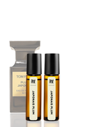 Two small bottles of 'Japonais Plum' perfume by Tom Ford on a white background