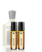Set of perfume bottles including a large bottle and two smaller rollerball bottles on a white background
