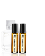 Two bottles of Universalis Aqua with black caps on a white background