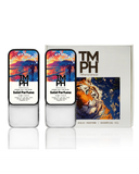 Two solid perfume containers with colorful labels and a box featuring a tiger illustration on a white background.