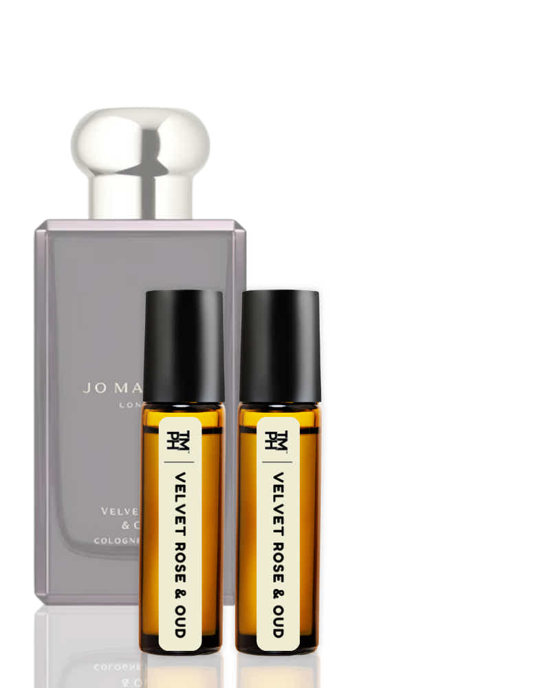 Two roller bottles of 'Velvet Rose & Oud' cologne by Jo Malone London on a white background.