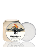 Beard balm container with mountain design and 'Guilty Yyy' branding on a white background