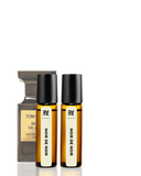 Two bottles of Tom Bihn Noir de Noir perfume on a white background