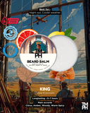 Beard balm packaging with a scenic background and product details.