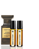 Tom Ford Amber Absolut perfume bottle and two rollerball bottles on a white background