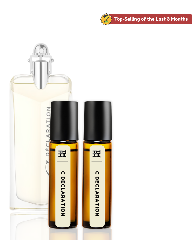 Perfume bottle and two roller bottles labeled 'C Declaration' on a white background.