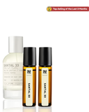 Three Santal 33 perfume bottles on a white background