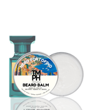 Beard balm container with a scenic label and a bottle on a white background