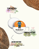 Beard balm container with notes on top, middle, and base notes on a white background