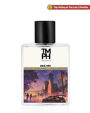 Perfume bottle with cityscape design and 'TM PH' branding on a white background
